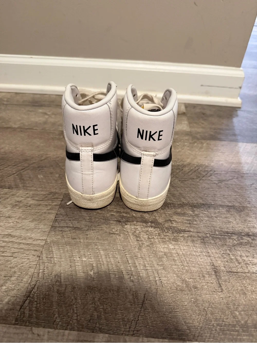 Nike High-Top Sneakers in White with Black Swoosh